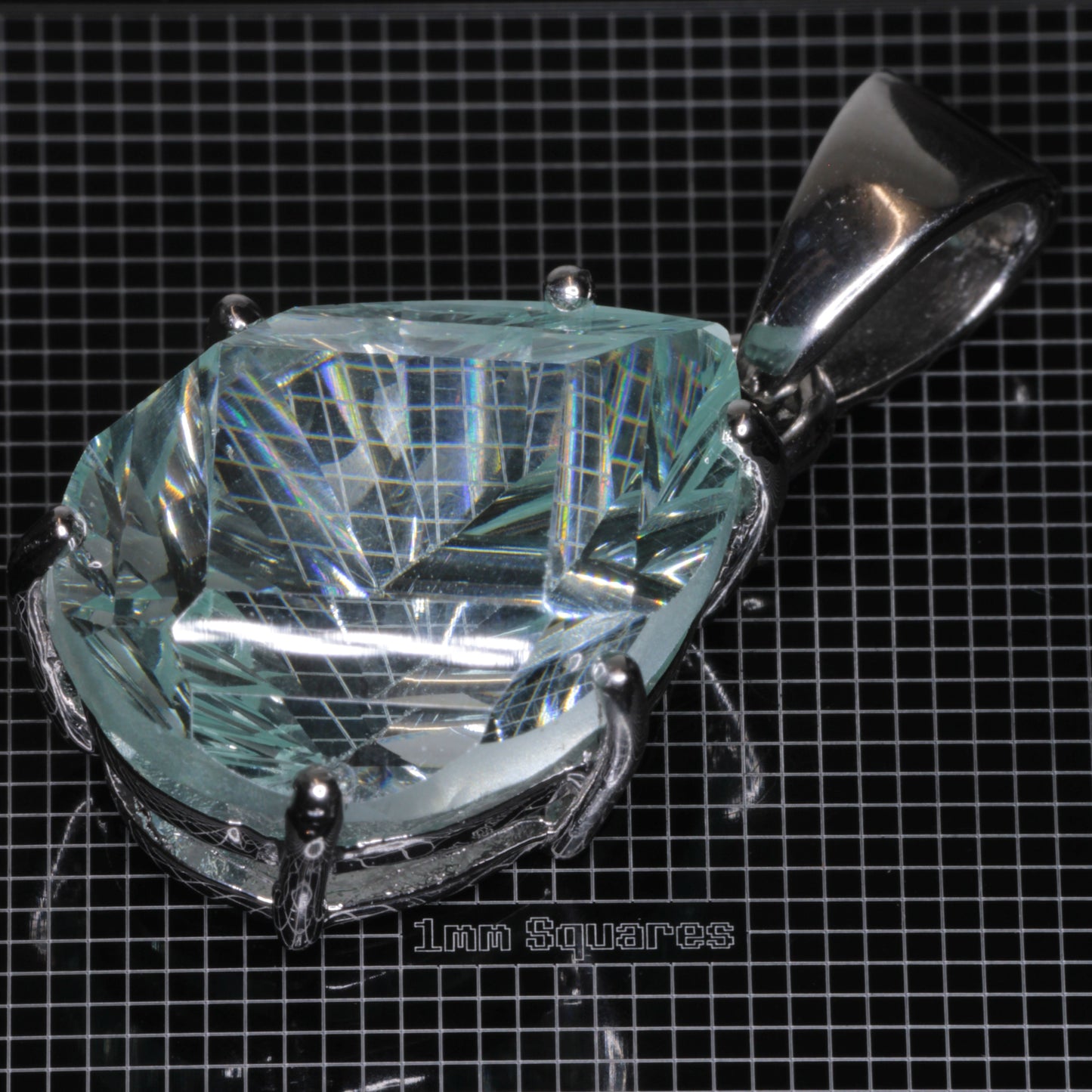 Fantasy Cut Pear-cut Light Blue Yb:YAG Gemstone in sterling silver pendants