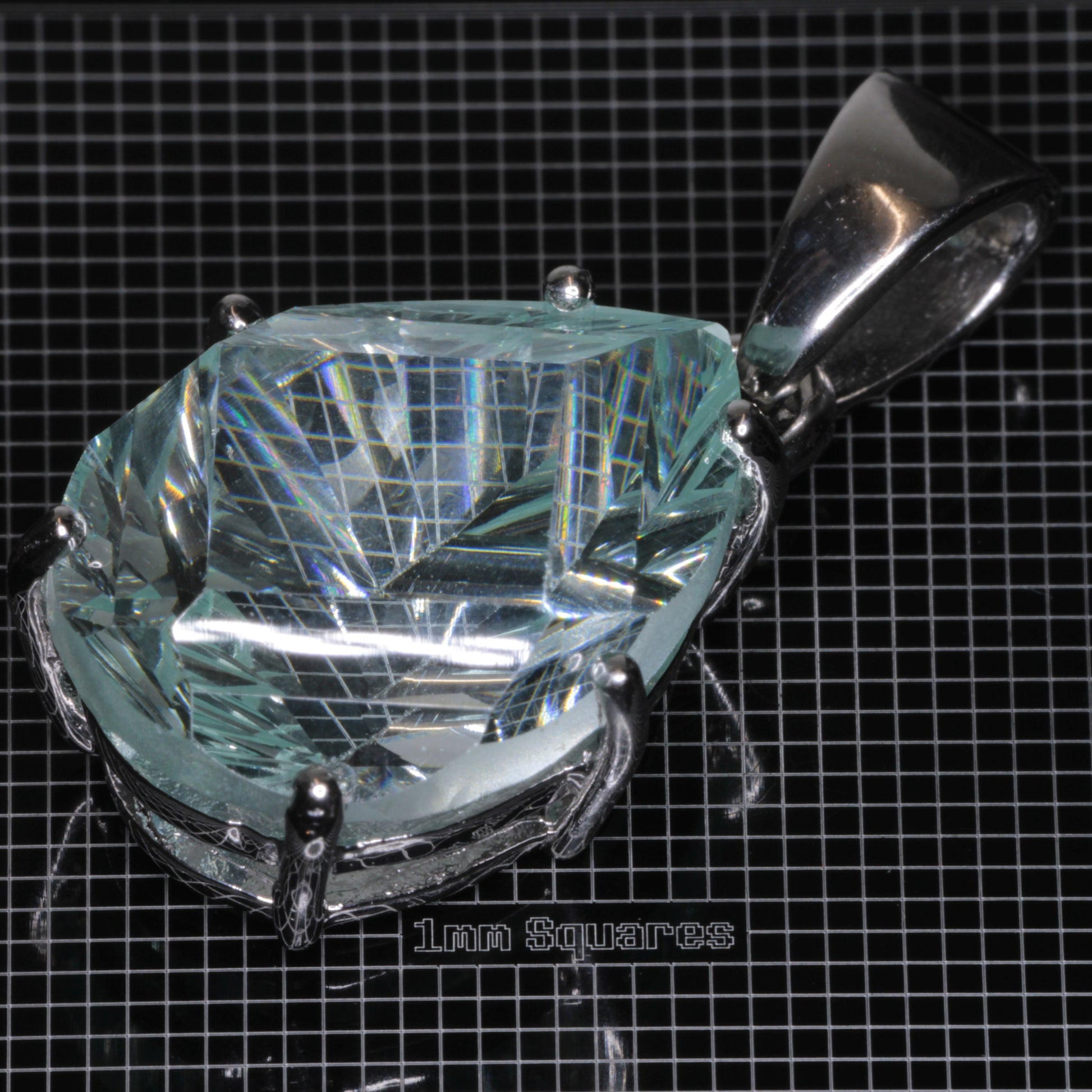 Fantasy Cut Pear-cut Light Blue Yb:YAG Gemstone in sterling silver pendants