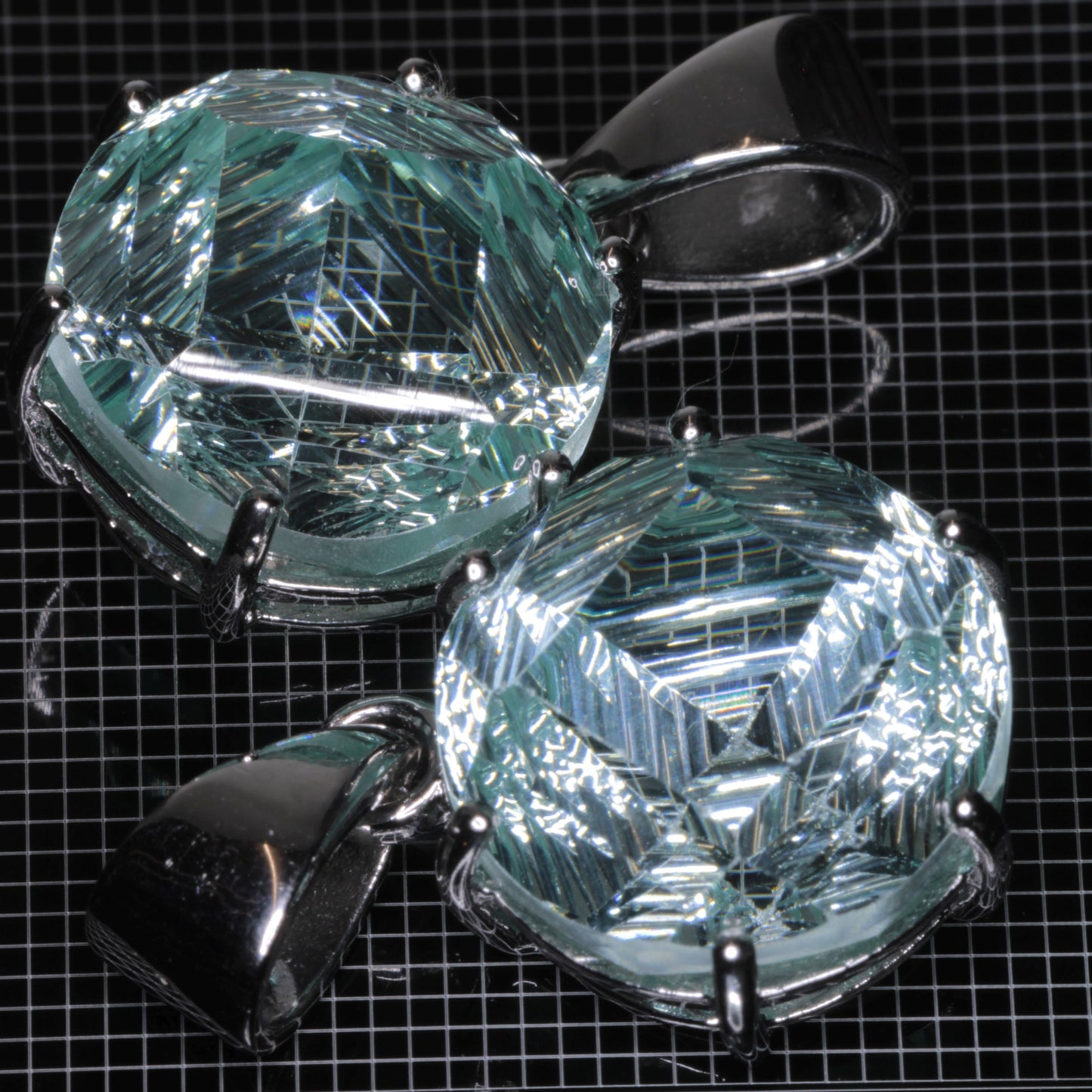 Fantasy Cut Light Blue Yb:YAG gemstones in sterling silver pendants