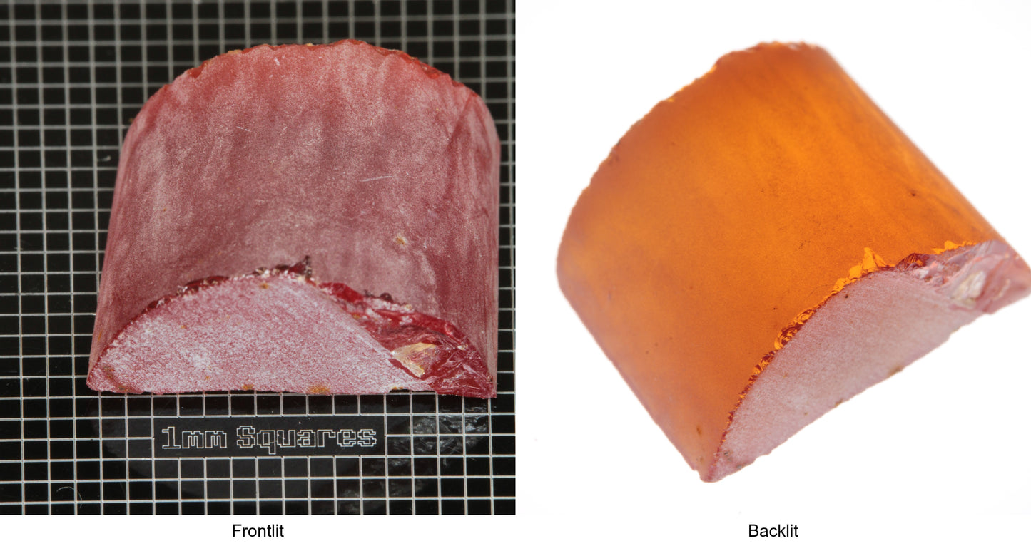 Rough Orange Flame Fusion Sapphire, Semicircle Shaped Piece shown in both normal light and backlit.