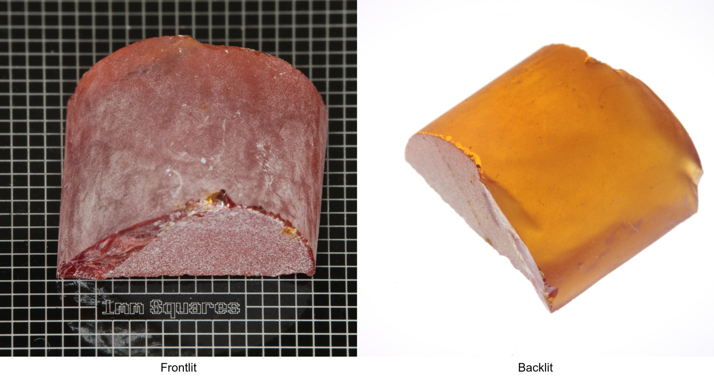 Rough Orange Flame Fusion Sapphire, Semicircle Shaped Piece shown in both normal light and backlit.