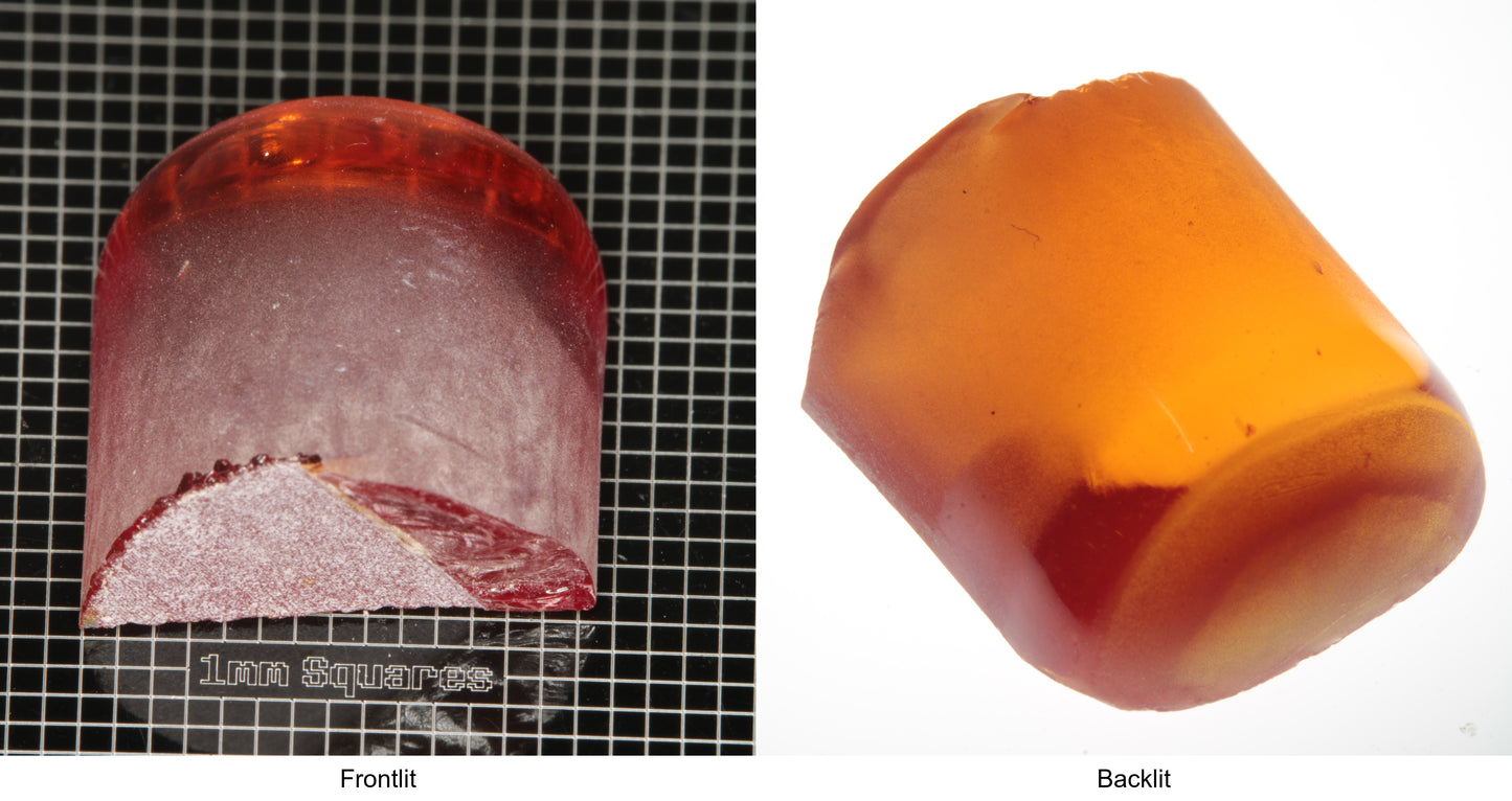 Rough Orange Flame Fusion Sapphire, Semicircle Tail Shaped Piece shown in both normal light and backlit.