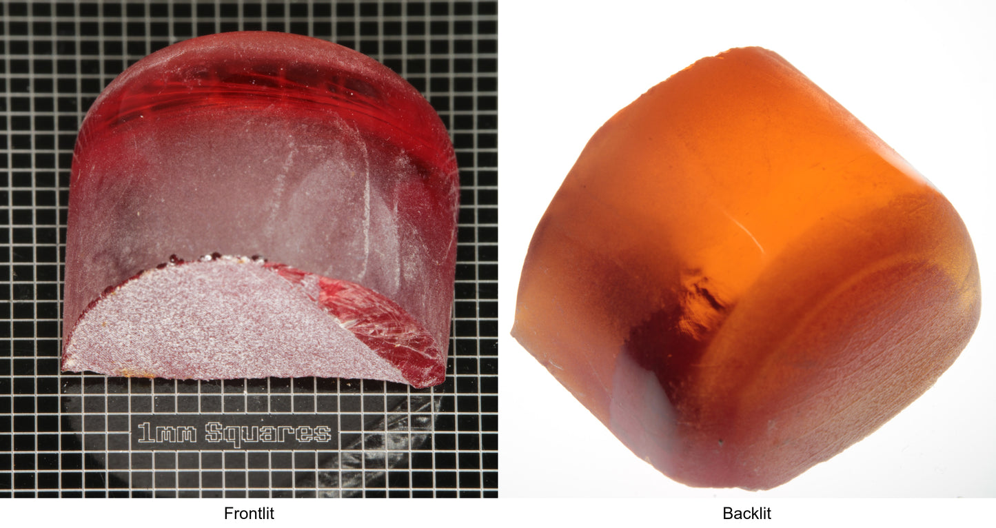 Rough Orange Flame Fusion Sapphire, Semicircle Tail Shaped Piece shown in both normal light and backlit.
